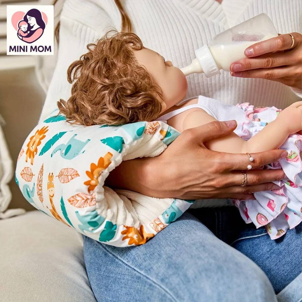 mother using breastfeeding pillow, holding a baby and bottle with 'MINI MOM' logo in the corner