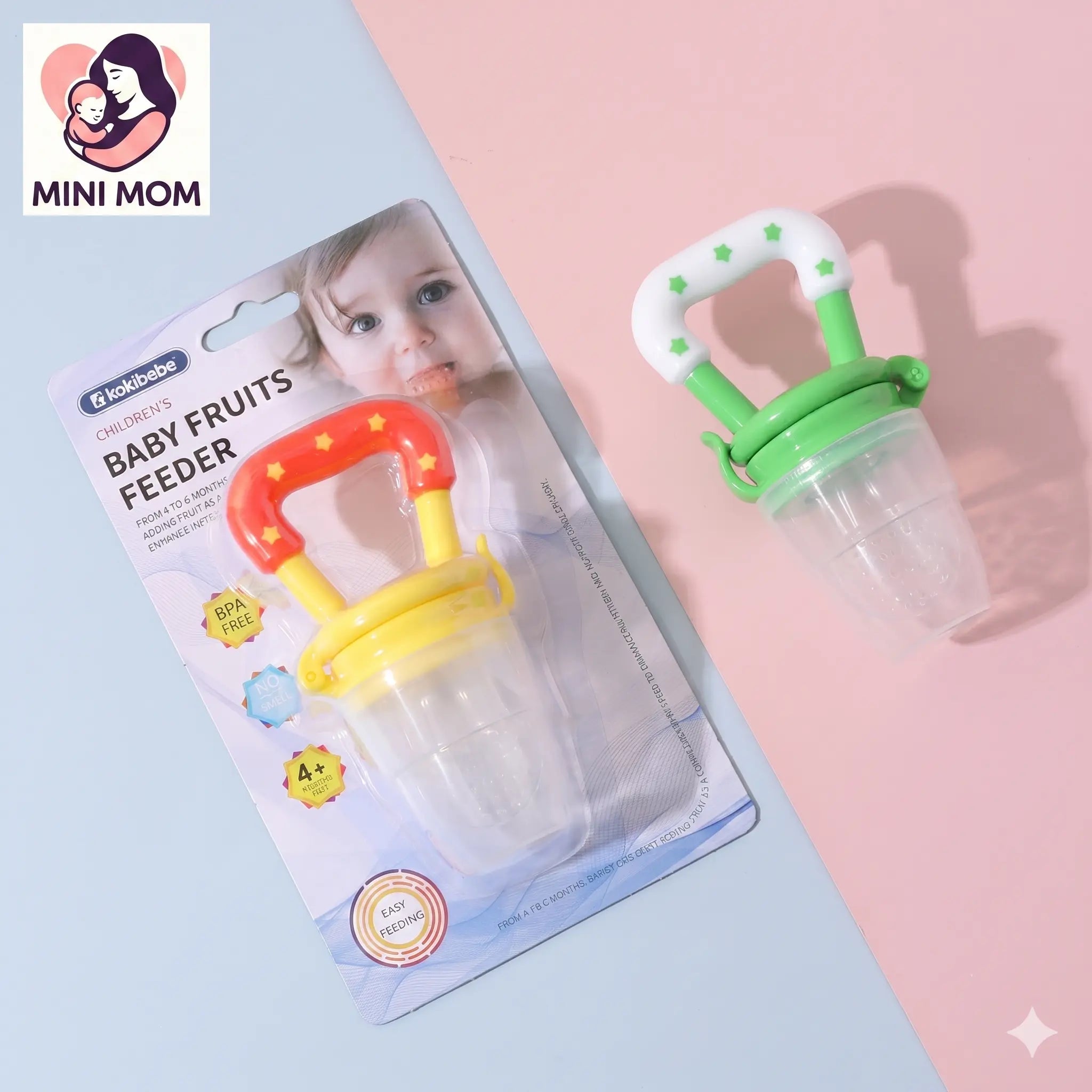 Baby fruits feeder with packaging on a light blue and pink background, featuring the Mini Mom brand.