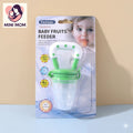 green & white colored baby fruits feeder packaging with a child's face on a beige background
