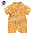 Yellow baby romper with white patterns on a white background, branded 'Mini Mom'.
