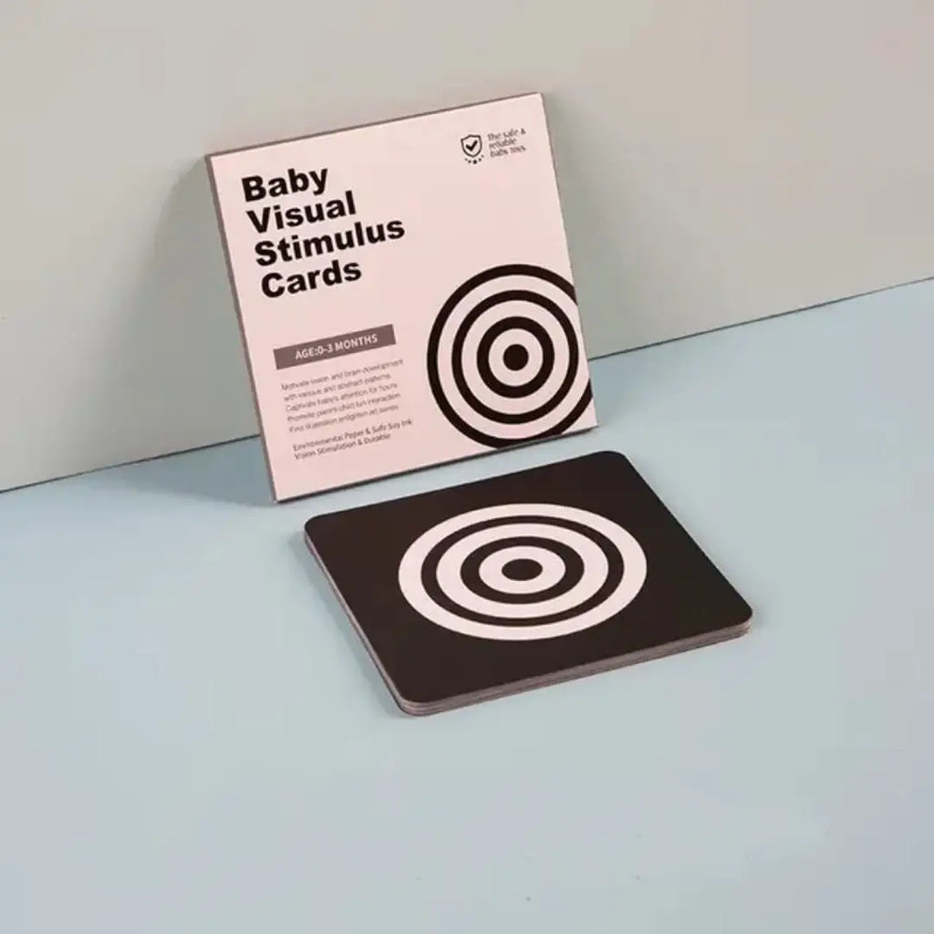 0-3 montsh baby visual stimulus cards with a pink packaging on a light blue surface