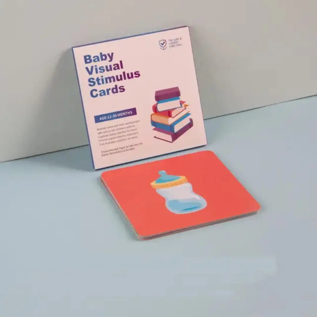 Baby visual stimulus cards with a card featuring a bottle illustration on a light blue surface.