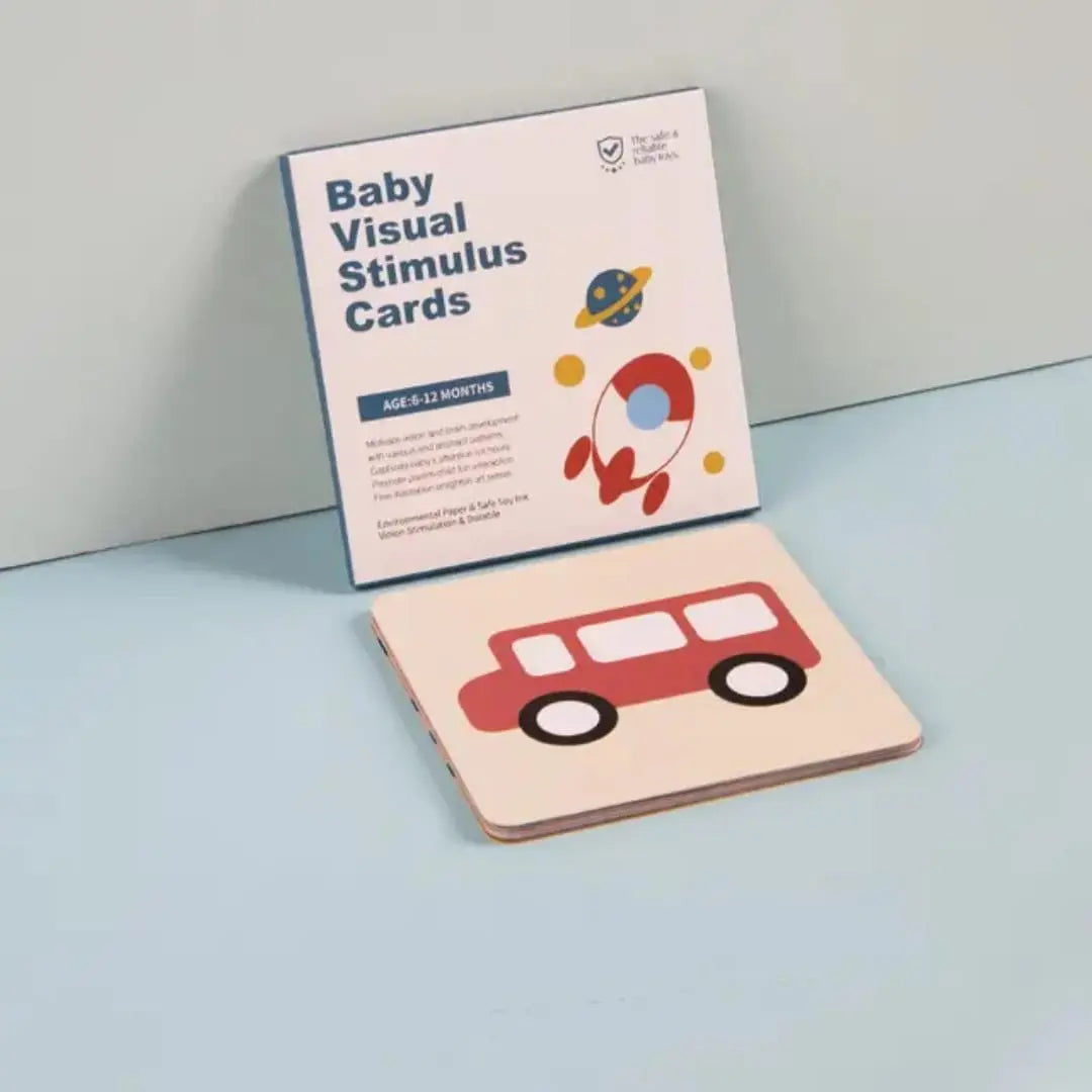 Baby visual stimulus cards with a car illustration on a light blue surface