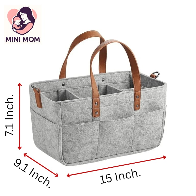 Gray diaper bag with brown handles and dimensions labeled, featuring the Mini Mom brand.