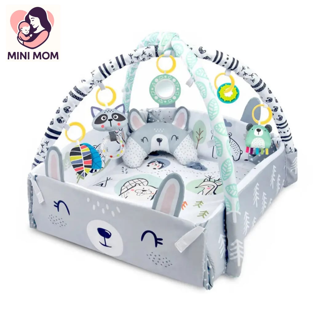 Baby play gym with toys and plush animals on a white background, featuring the brand 'Mini Mom'.