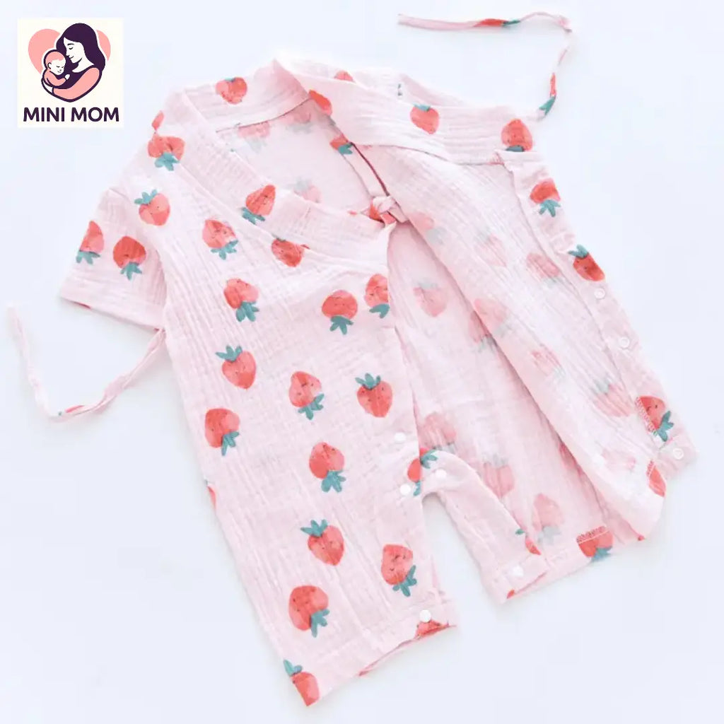 Baby outfit with strawberry pattern on a white background, branded as Mini Mom.