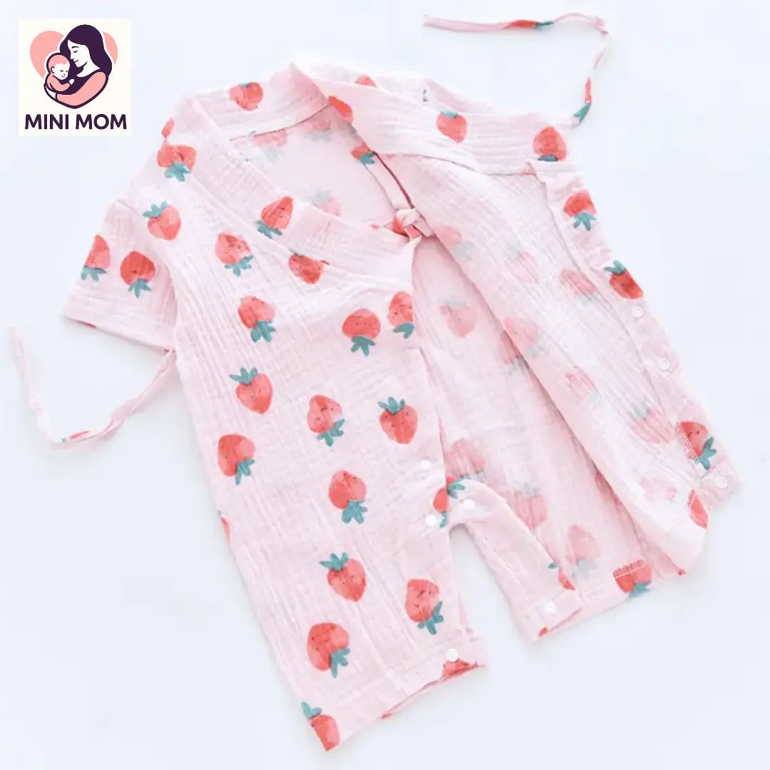 Baby outfit with strawberry pattern on a white background, branded as Mini Mom.