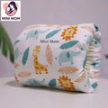 breastfeeding hand pillow with animal patterns and 'Mini Mom' branding on a light background
