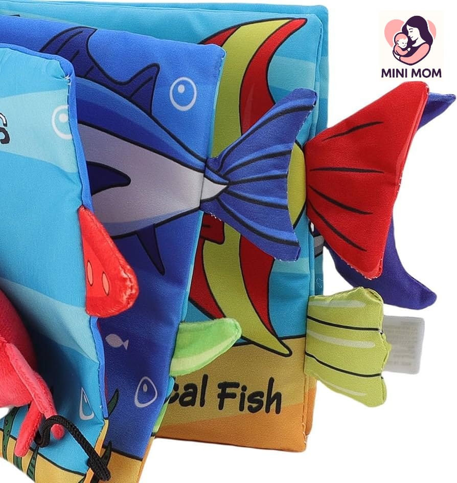 Colorful fish-shaped soft book with 'MINI MOM' branding on a white background
