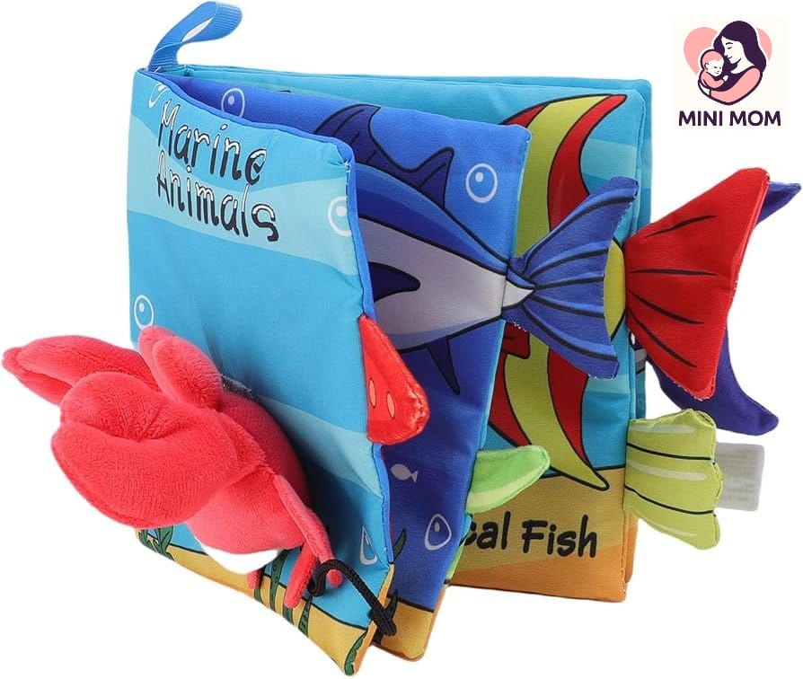 Colorful soft book for children with marine animal illustrations and 'Mini Mom' branding.
