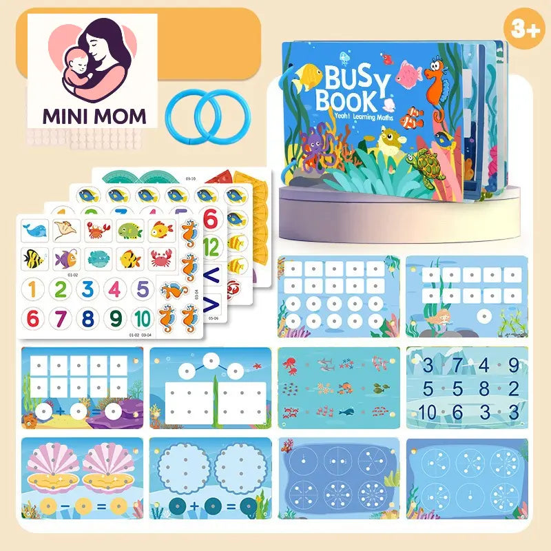 Educational children's toys including a Busy Book and flashcards on a beige background.